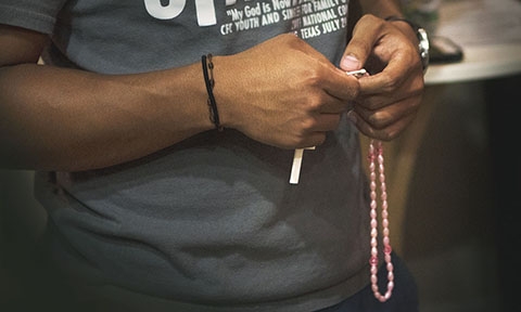 Student Holding Rosary